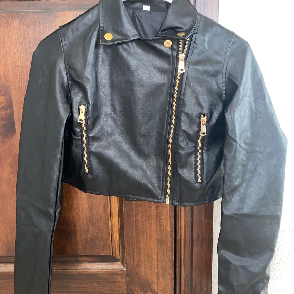 Black leather jacket with gold zippers